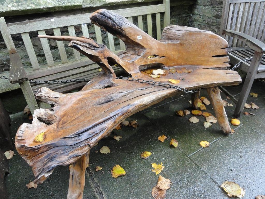 Appraisal: A rustic garden bench with weathered timber construction