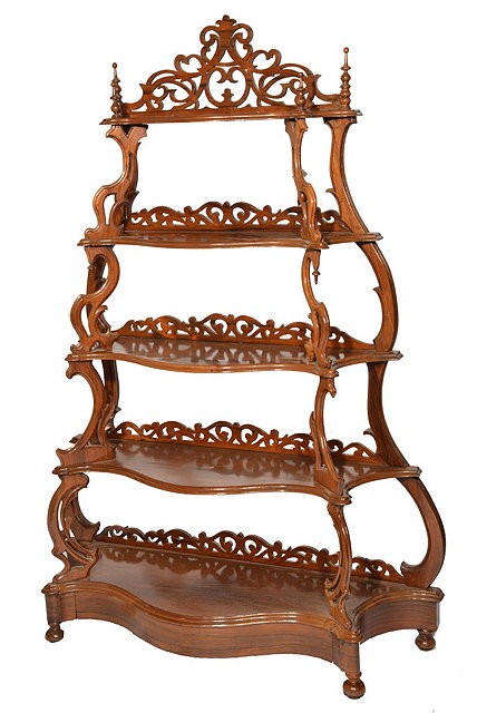 Appraisal: A VICTORIAN ROSEWOOD FIVE TIER WHATNOT with carved supports finials