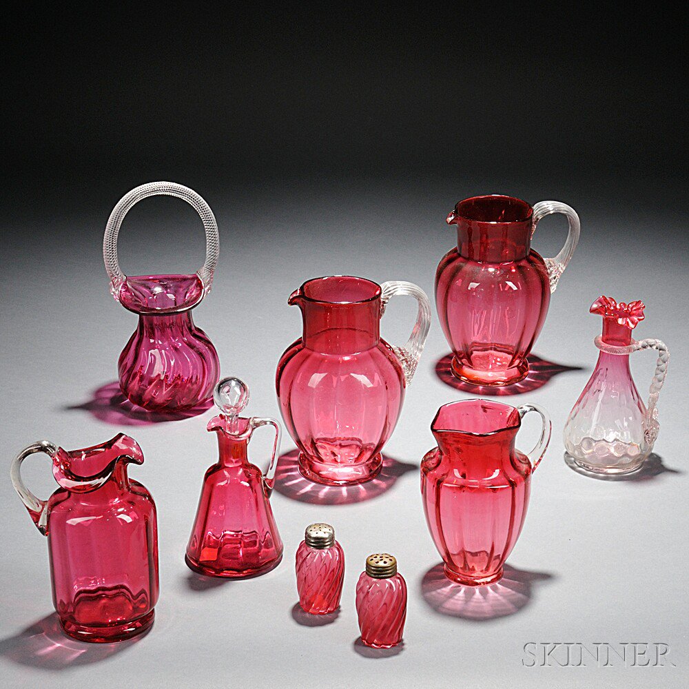 Appraisal: Nine Pieces of Cranberry Glass Tableware four pitchers ht and