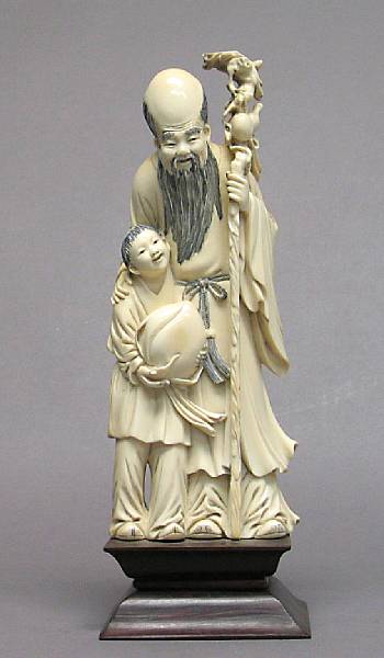 Appraisal: A Chinese tinted ivory figure of Shoulao with a child