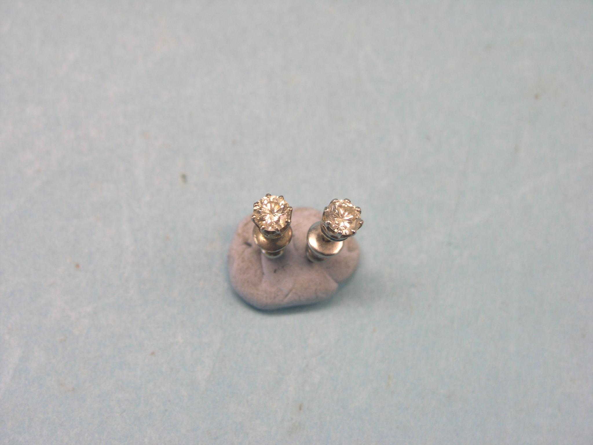 Appraisal: A pair of diamond ear-studs each stone approx ct