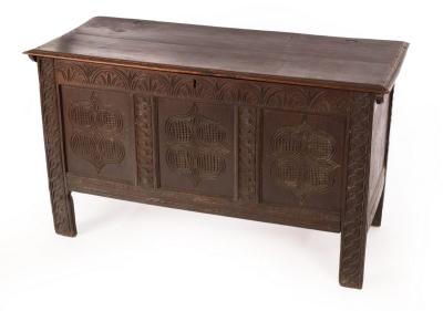 Appraisal: A late th Century oak coffer with twin-panelled hinged cover