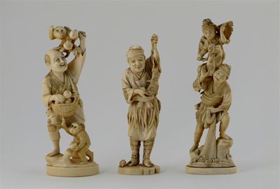 Appraisal: Three Japanese ivory carvings of figures one of a fruit