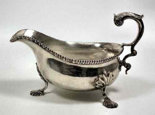 Appraisal: A George V Scottish silver oval sauce boat of large