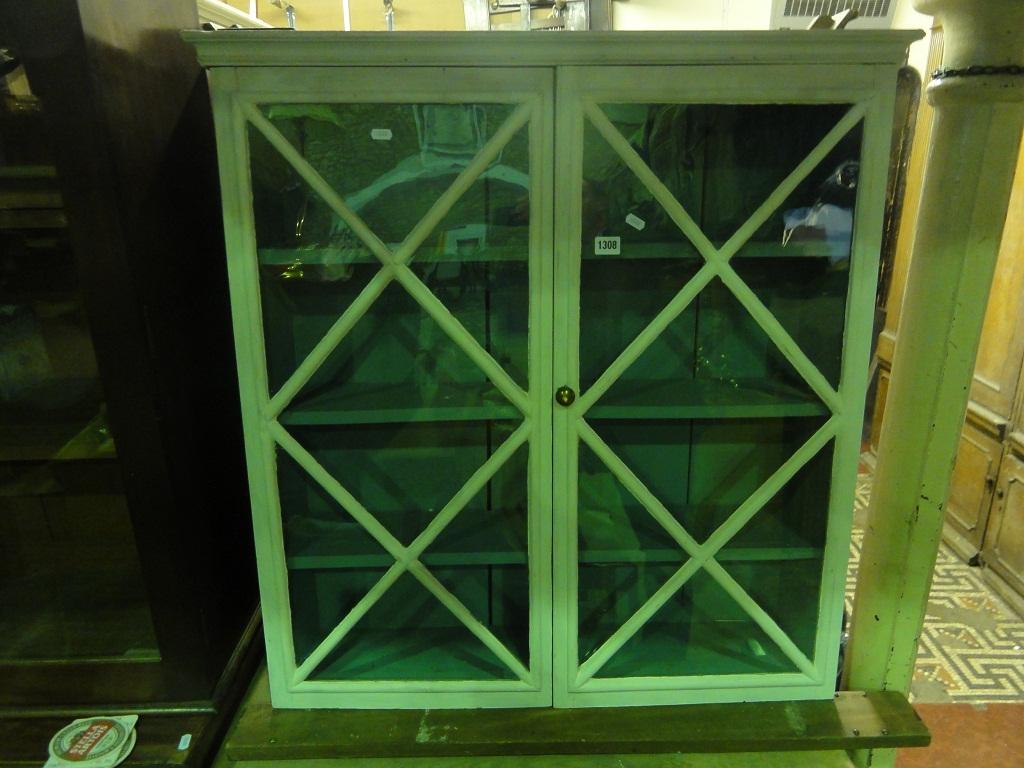 Appraisal: A painted pine display case enclosed by a pair of