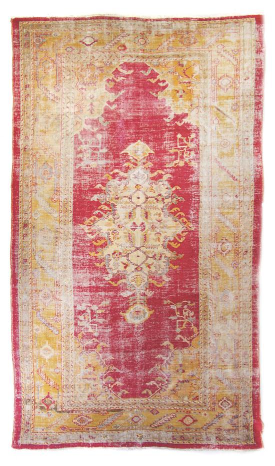 Appraisal: n Oushak Rug the wool rug with scrolling foliate decoration