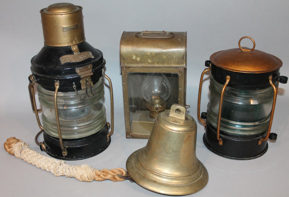 Appraisal: A thC brass ship's bell with rope cord unmarked cm