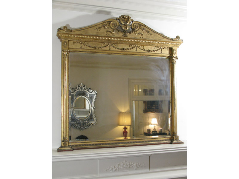 Appraisal: Grandiose Overmantel Mirror th c beveled glass with ornate gilt