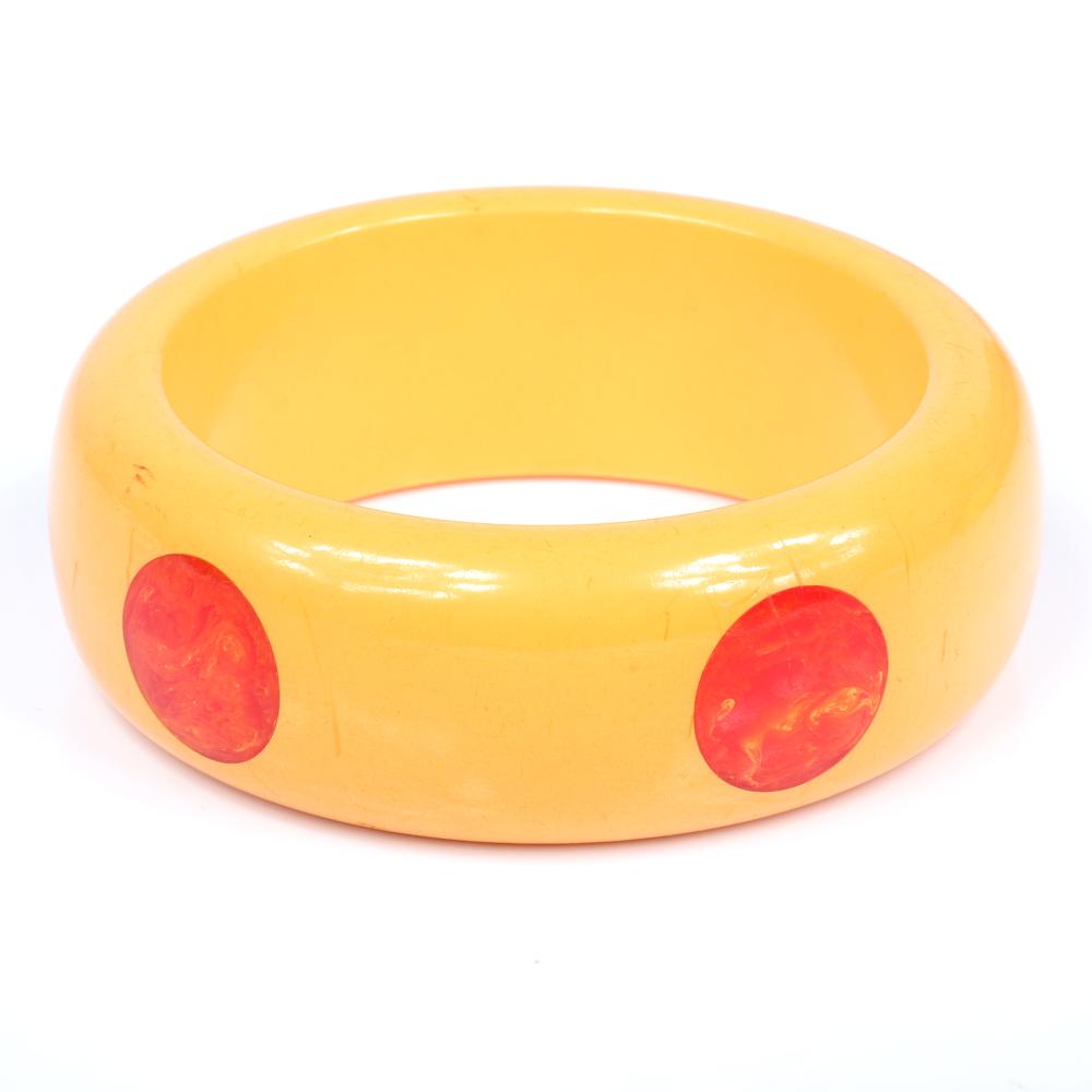 Appraisal: VINTAGE BAKELITE DOT CHUNKY CUSTARD BANGLE BRACELET WITH MARBLED ORANGE