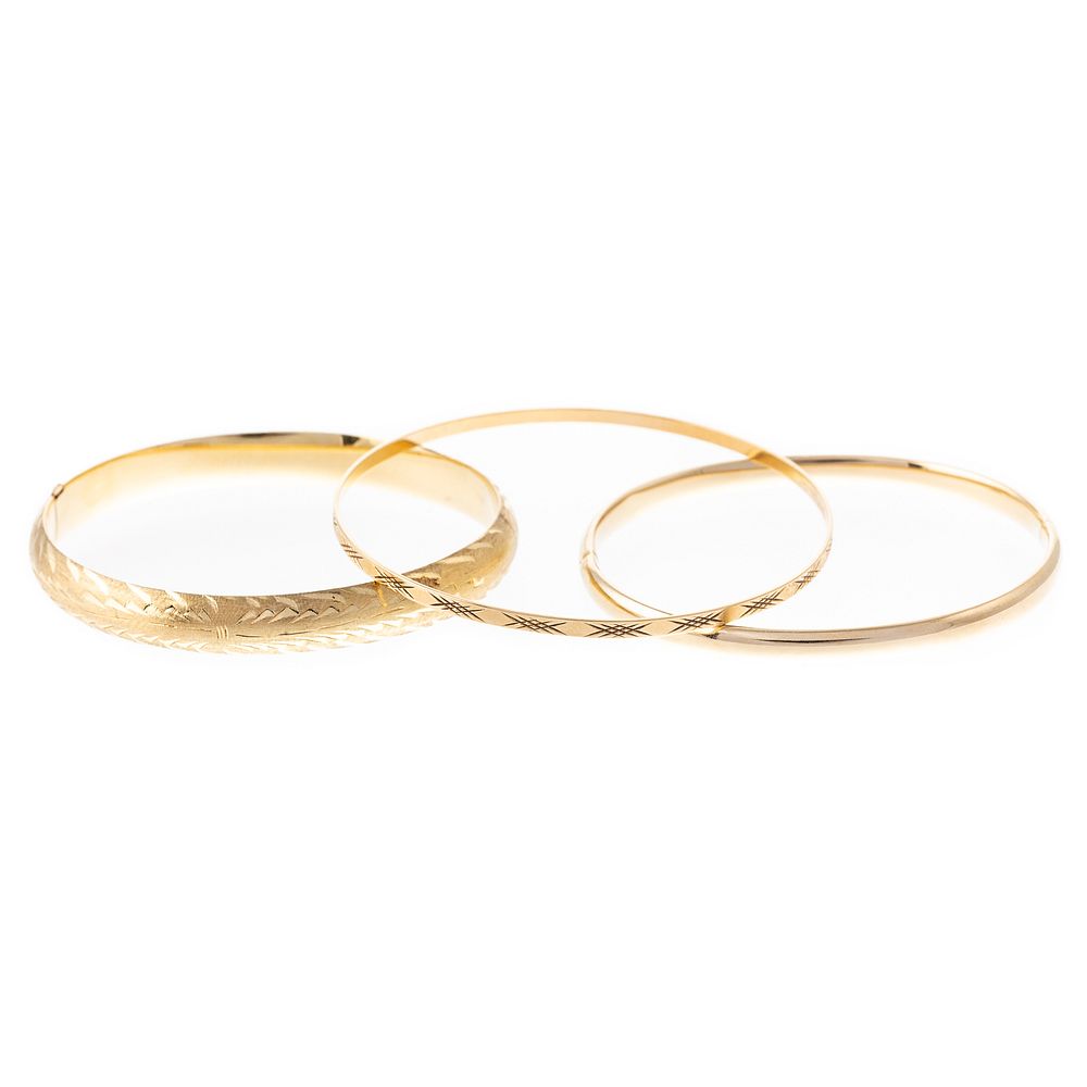 Appraisal: A Trio of Bangle Bracelets in K K yellow gold