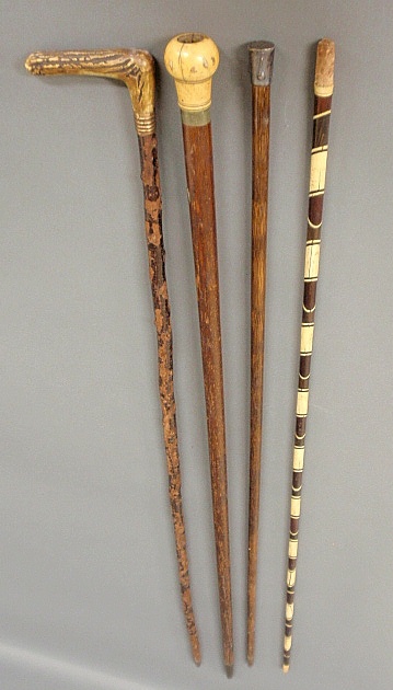 Appraisal: - Four walking sticks incl an ivory tipped example w