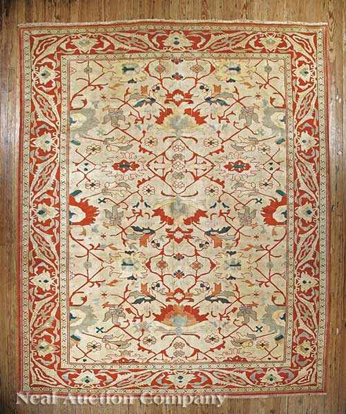 Appraisal: A Persian Serapi Carpet cream and red ground allover stylized