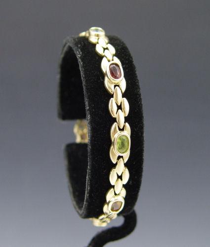 Appraisal: K MULTI GEMSTONE BRACELET K yellow gold bracelet contains eight