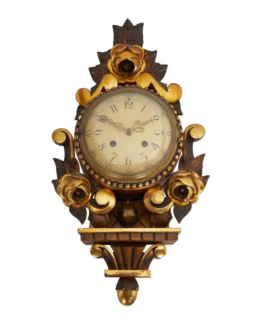 Appraisal: A SWEDISH GILT-WOOD CARTEL CLOCKA Swedish gilt-wood cartel clock Mid-