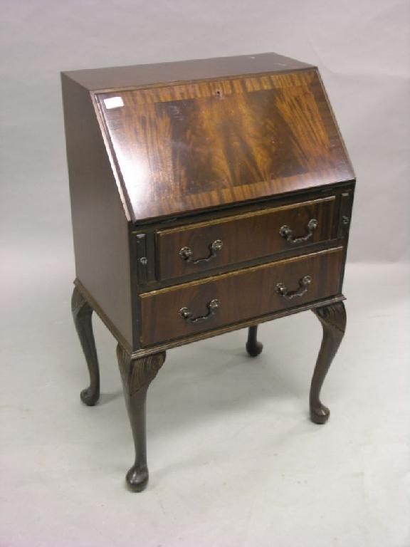 Appraisal: A cross-banded lady's mahogany bureau fitted interior above two drawers