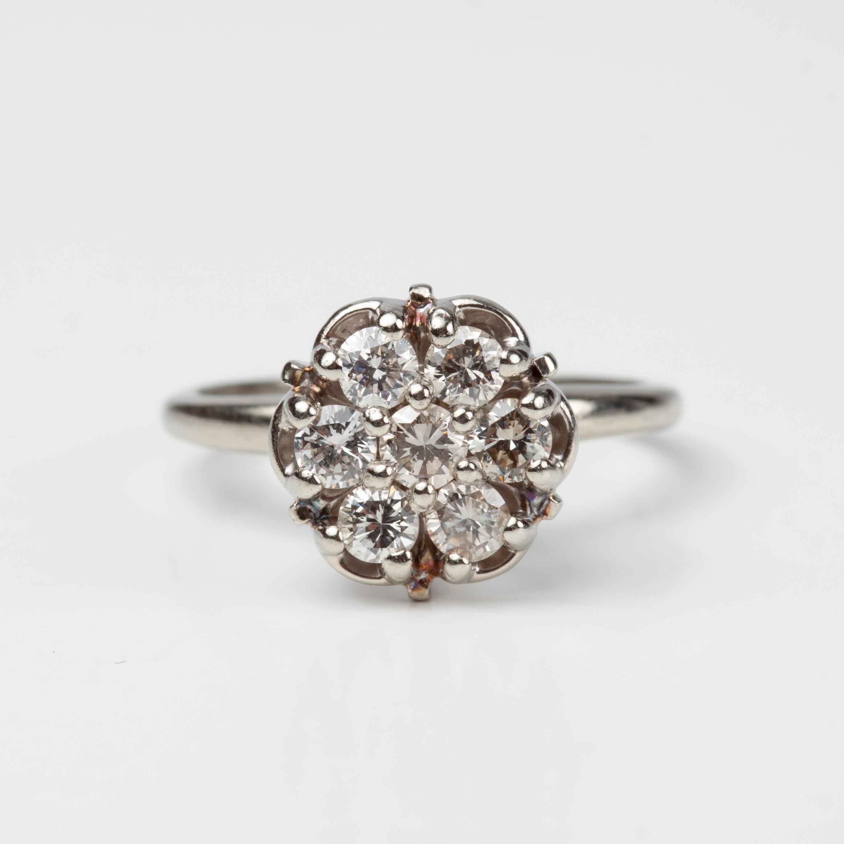 Appraisal: K DIAMOND RING WITH FLOWER MOTIF CTW A k white