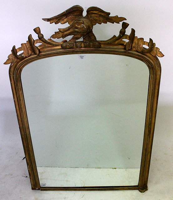 Appraisal: A GILT FRAMED ARCHED WALL MIRROR with carved gilt thistle