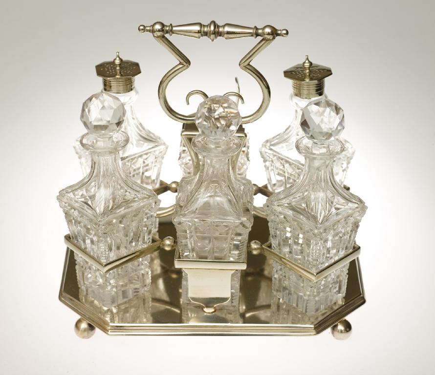 Appraisal: LATE VICTORIAN SILVER-PLATED AND CUT-GLASS SIX-BOTTLE CRUET SET the rectangular