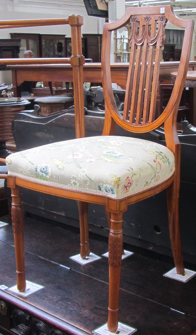 Appraisal: An early th century satinwood shield back single chair on