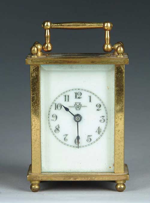 Appraisal: CASED MINATURE CARRIAGE CLOCK Standard form with white dial Small