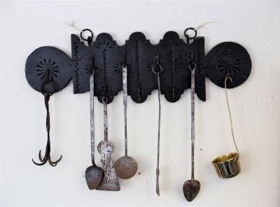 Appraisal: A Spanish carved wall rack with wrought iron hooks cm