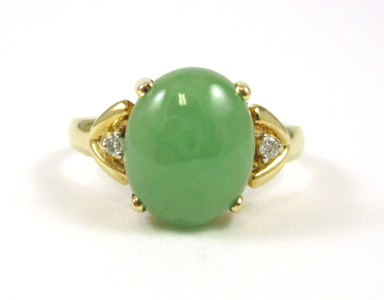 Appraisal: JADE DIAMOND AND FOURTEEN KARAT GOLD RING with two round-cut