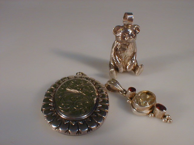 Appraisal: A continental silver stone set pendant a teddy bear charm