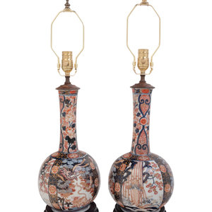 Appraisal: A Pair of Imari Palette Porcelain Bottle Vases Mounted as