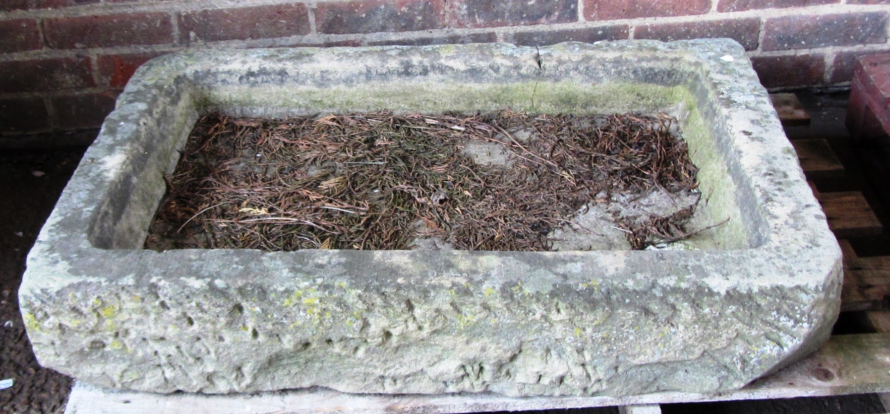 Appraisal: A shallow stone carved rectangular sink x cm