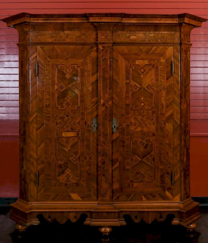 Appraisal: AN INTRICATELY INLAID TH CENTURY GERMAN SCHRANK With dramatically outset