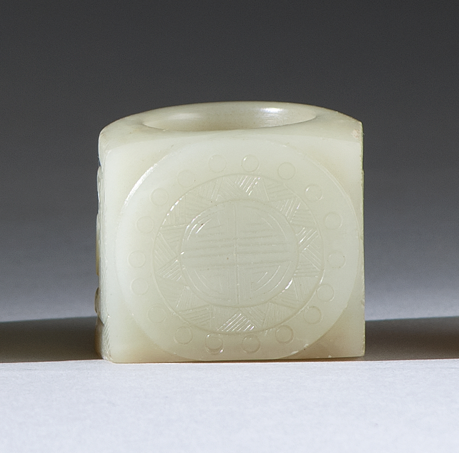 Appraisal: CELADON JADE THUMB RING Circa Carved with flattened shou medallion