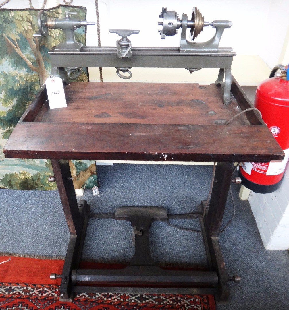 Appraisal: A bench mounted green painted metalwork lathe early th century