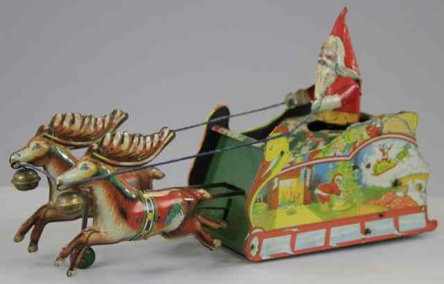 Appraisal: SANTEE CLAUS SLEIGH TOY Ferdinand Strauss lithographed tin colorful sleigh