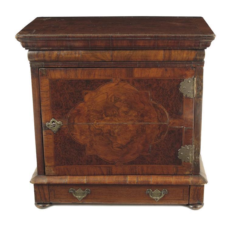 Appraisal: An early th century walnut table cabinet