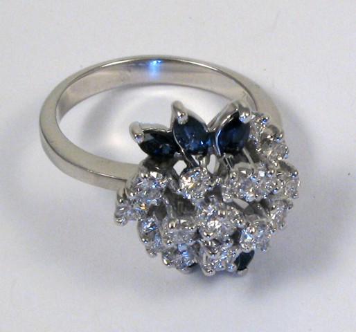 Appraisal: SAPPHIRE AND DIAMOND CLUSTER RING k white gold set with