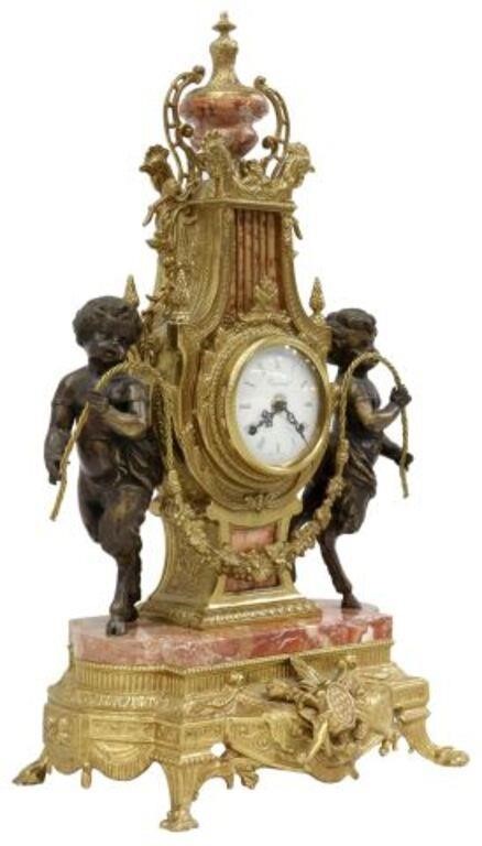 Appraisal: Neoclassical style gilt metal mantel shelf clock th c urn-form