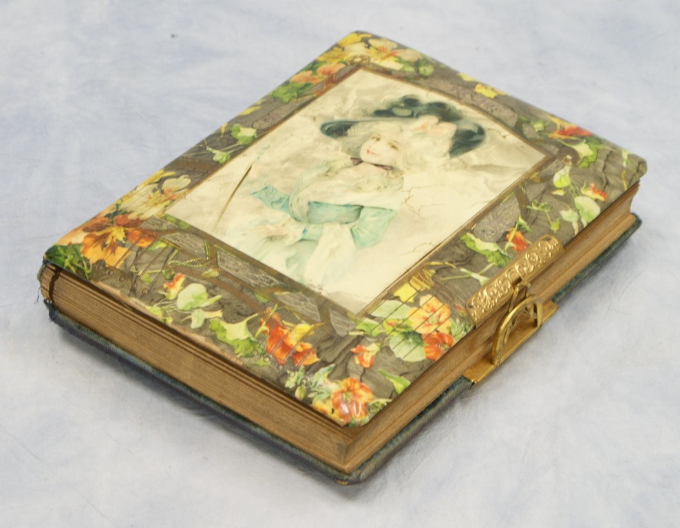 Appraisal: Victorian Celluloid and Velvet Photo album with lady decoration contains