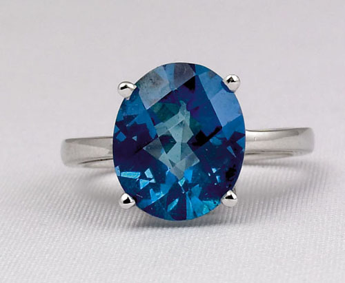 Appraisal: K white gold solitaire ring with large oval cut blue