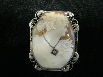 Appraisal: Yellow gold and diamond portrait cameo broochLady's profile portrait cameo