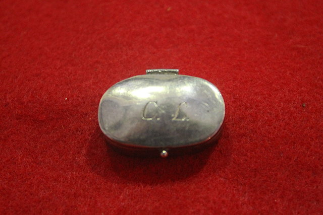 Appraisal: A CONTINENTAL SILVER PILL BOX of plain oval form monogrammed