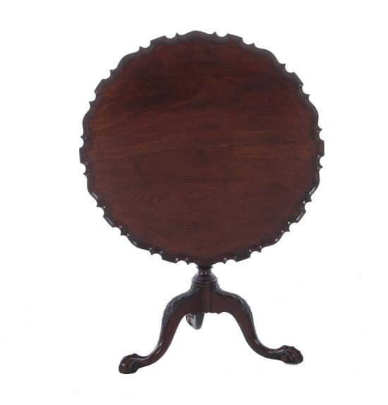 Appraisal: Georgian style carved mahogany tilt-top tea table mid th century