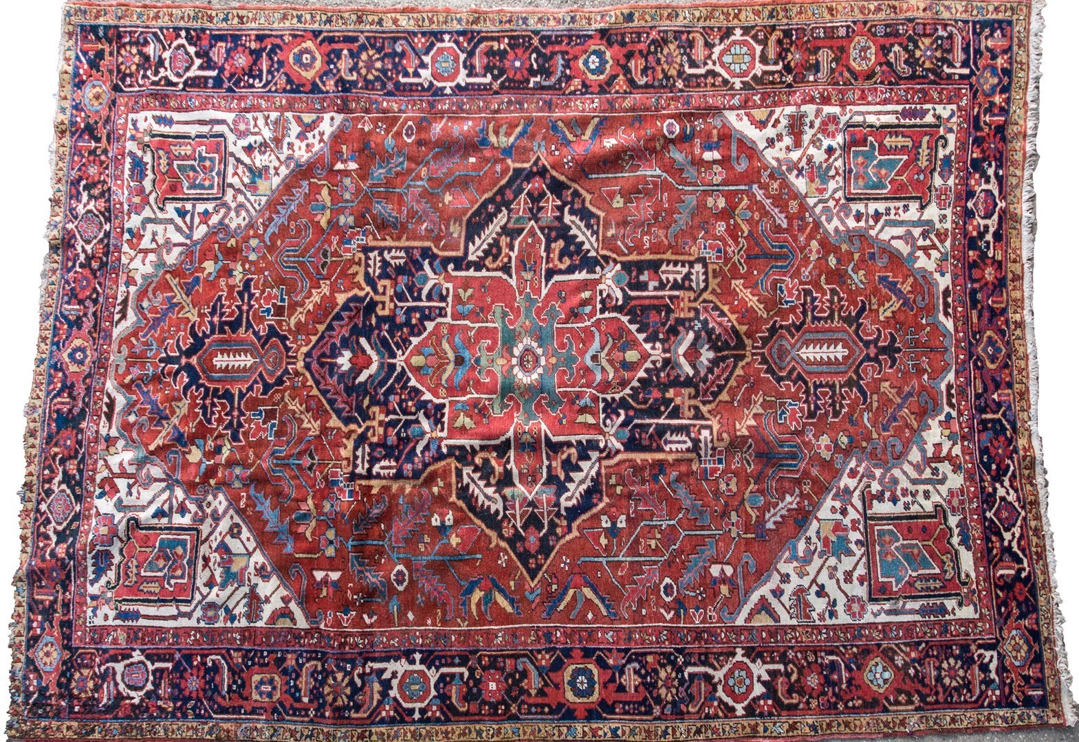 Appraisal: An Heriz carpet Persian the madder field with a bold