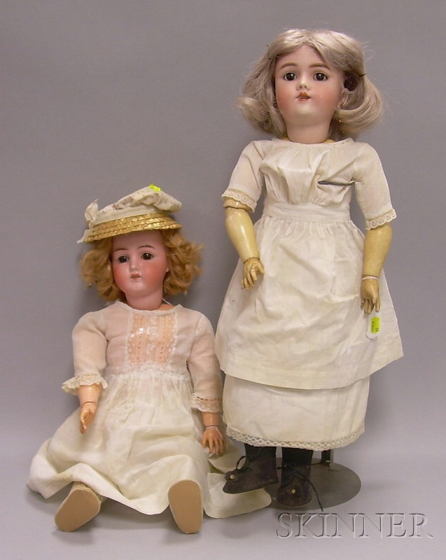 Appraisal: Two German Bisque Dolls in White Dresses one bisque head