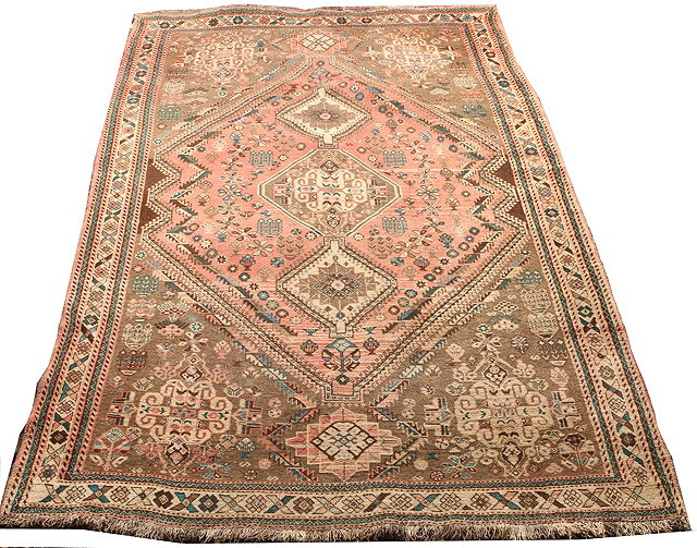 Appraisal: A PERSIAN SHIRAZ RUG with three central diamond medallions within