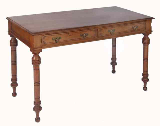 Appraisal: A VICTORIAN OAK SIDE TABLE fitted with two frieze drawers