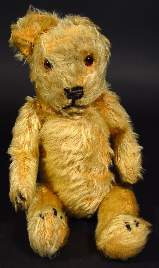 Appraisal: s golden straw filled teddy bear with jointed limbs cm