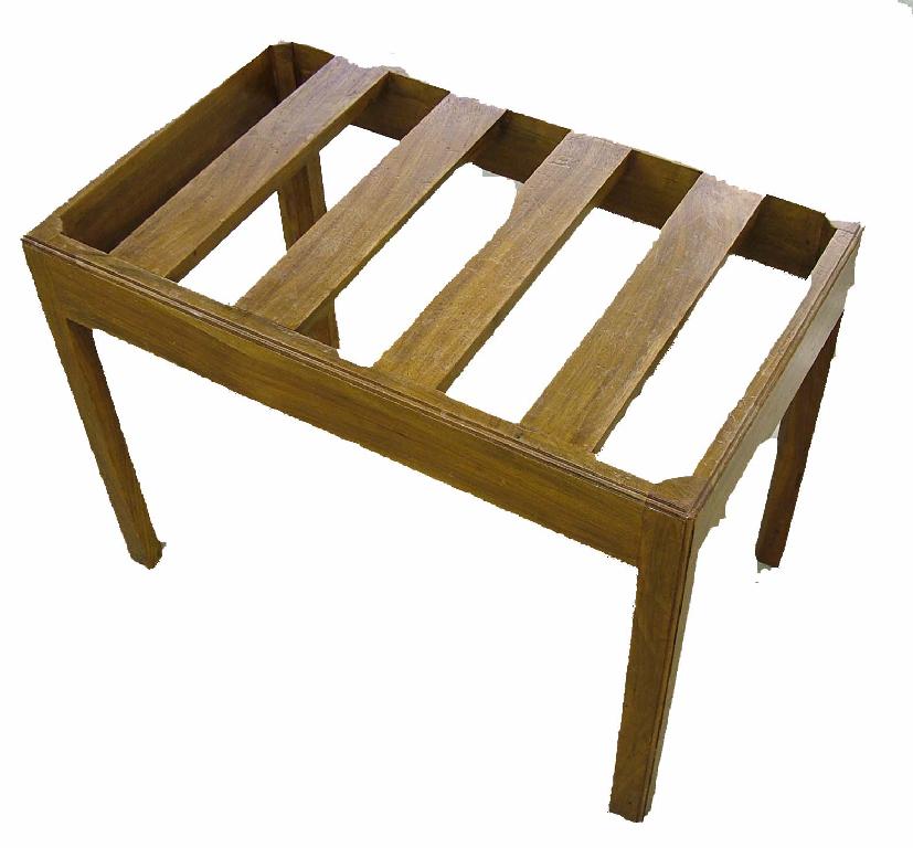 Appraisal: Heal's walnut luggage rack upon square canted supports circular inset