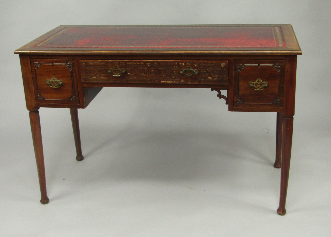 Appraisal: A Chinese Chippendale style mahogany desk with a tooled red