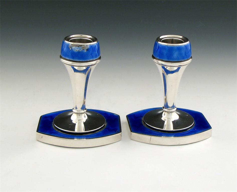 Appraisal: A pair of silver and blue enamel dressing table candlesticks