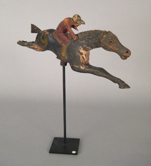 Appraisal: Carved and painted horse and jockey carnival game figure late